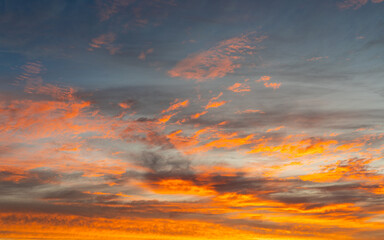 Wall Mural - colorful orange clouds at sunset time.