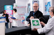 © DC Studio - Senior man checking drugstore medications order in shopping bag at counter desk, buying prescription medical products. Pharmacy store elderly cashier giving assistance in purchasing medicaments
