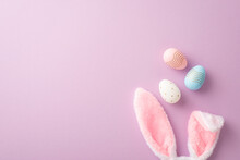 Easter Concept. Top View Photo Of Fluffy Bunny Ears And Colorful Easter Eggs On Isolated Lilac Background With Copyspace