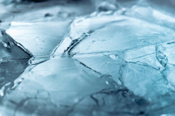 Wall Mural - Abstract ice background. Blue background with cracks on the ice surface