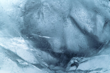 abstract ice background. blue background with cracks on the ice surface