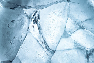 abstract ice background. blue background with cracks on the ice surface