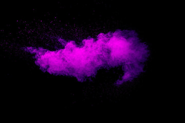 Wall Mural - purple color powder explosion cloud on black background.purple dust particles splash.