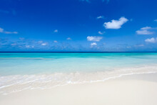 White Sand Beach With Turquoise Water And Blue Sky