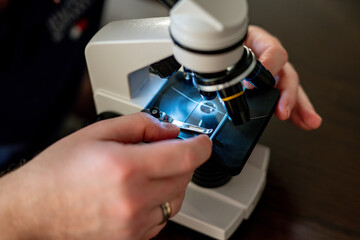  Microscope close-up. research under magnification. Amateur microscope for home study. scientific equipment