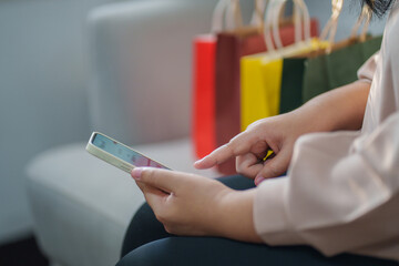 Poster - Hands of woman using mobile phone for online shopping..