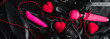 Various sex toys set on a black background. The view from the top. Horizontal wide photo subtitle, cover. copy-space