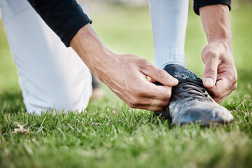 Poster - Closeup, fitness and man tie shoe, hands and exercise for wellness, healthy lifestyle and on field. Zoom, male athlete and player with shoelace, training or workout for balance, sports or competition