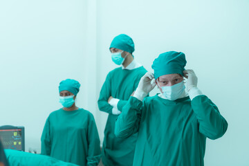 Portrait of professor of medicine in cardiology and a team of doctors in the operating room undergoing heart transplant surgery