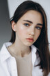 © Ananass - stylish portrait of a young 15-year-old model girl with natural light in a spacious photo studio