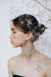 © Ananass - stylish portrait of a young 15-year-old model girl with natural light in a spacious photo studio
