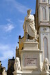 Dante alighieri. Dante Alighieri in Florence.Statue of Dante in Piazza Santa Croce. Blue sky background. 