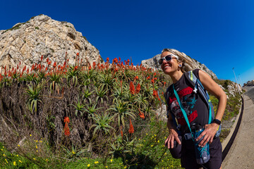 Female hiker enjoying the flowing succulent garden in Gibraltar 