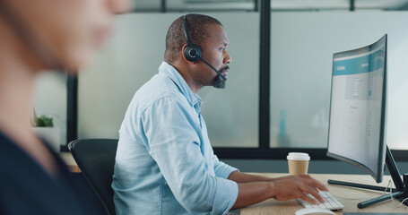 Business, black man and call center for customer service, telemarketing and typing in office. Agent, consultant and African American male with computer, digital marketing, help and online support.