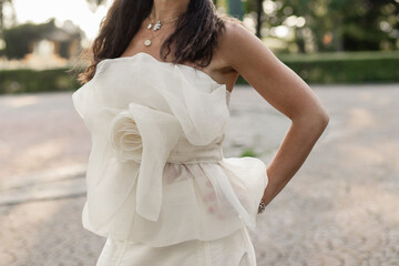 Sticker - the bride in a white wedding dress in the park at sunset