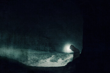 Wall Mural - A superntaural concept of a transparent hooded ghostly figure. Silhouetted on the edge of a tunnel. On a spooky night. With a grunge, blurred edit.