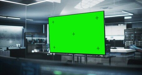 Leinwandbilder - Empty Meeting Conference Room with Green Screen Mock Up TV Display. Establishing Shot in a Technologically Advanced Research and Development Office. Manager Walking in the Background
