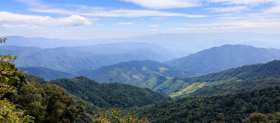 Wall Mural - beautiful valley landscape view with blue sky and green mountain nature for background