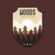 Woods logo vector design with trees nature landscape. Camping badge graphics in retro style. Travel colorful emblem. Stock vector adventure label