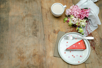 red jelly cheesecake, sweet dessert with flowers bouquet, cup of coffee on wooden table background. gift to woman on March 8 holiday, valentine's day breakfast food, international Women's Day,romantic