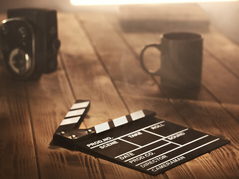 Fototapete - Movie clapperboard on the table
