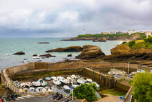 Panoramic View Of The Fishing Port With The Lighthouse In The Background At Low Tide And A Rainy Day. Biarritz, France