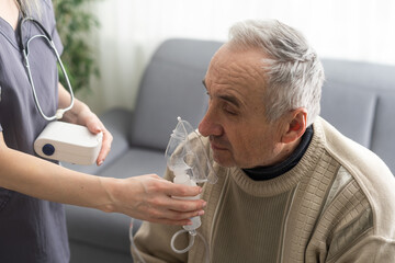 Wall Mural - Sick elderly man makes inhalation.