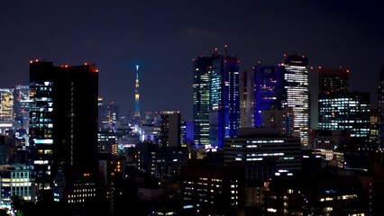 Wall Mural - TOKYO - OCT 1st, 2022: Skyscrapers at night in Minato, Tokyo, Japan with a view of the Sky tree