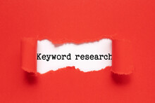 Memo note written with text keyword research on red background. Business Concept.