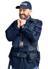 Poster - Young handsome man wearing police uniform laughing nervous and excited with hands on chin looking to the side