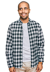 Poster - Hispanic adult man wearing casual clothes smiling looking to the side and staring away thinking.