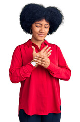 Poster - Young african american girl wearing casual clothes suffering pain on hands and fingers, arthritis inflammation