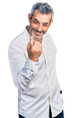 Sticker - Middle age hispanic with grey hair wearing casual white shirt beckoning come here gesture with hand inviting welcoming happy and smiling