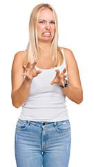 Poster - Young blonde girl wearing casual style with sleeveless shirt disgusted expression, displeased and fearful doing disgust face because aversion reaction.