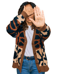 Wall Mural - Middle age hispanic woman wearing casual clothes covering eyes with hands and doing stop gesture with sad and fear expression. embarrassed and negative concept.