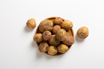 Wall Mural - Top view of potatoes root food concept light surface