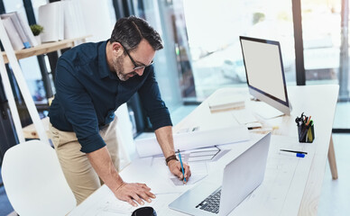 Aufkleber - Hes the best architect around. Shot of a mature male architect using his laptop.