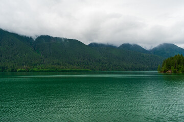 Wall Mural - tranquil lake with clouds and fog