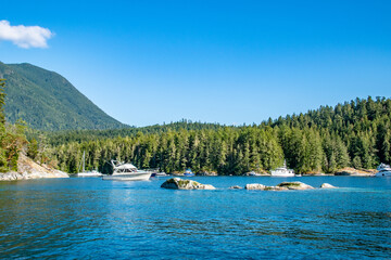 Wall Mural - Desolation Sound Yacht Boat Near Mountains in Summer on Strait of Georgia in Vancouver Island, British Columbia, Canada