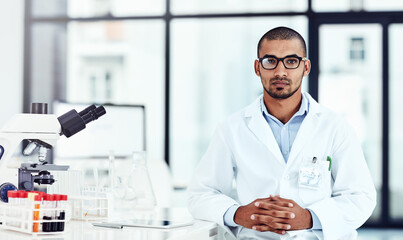 Aufkleber - Hes an important part of the scientific lab. Cropped shot of a young male scientist working in his lab.