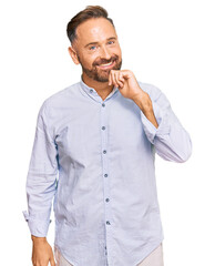 Poster - Handsome middle age man wearing business shirt looking confident at the camera with smile with crossed arms and hand raised on chin. thinking positive.