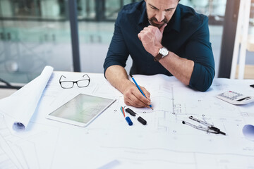 Aufkleber - Determining the necessary calculations to make the buildings work. Shot of a mature male architect working on a design.