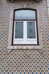 Wall Mural - Typical tiled facade in Lisbon with window