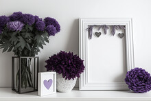 Black Mock Frame With Purple Mum Flowers, Hearts, And Décor. Decorations For Mother's Day. White Wall With A White Shelf. Copy Space. Generative AI