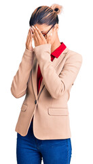 Poster - Young beautiful woman wearing business shirt and glasses with sad expression covering face with hands while crying. depression concept.