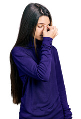 Poster - Young brunette girl with long hair wearing turtleneck sweater tired rubbing nose and eyes feeling fatigue and headache. stress and frustration concept.