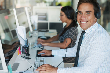 Poster - His expertise makes for an excellent customer service experience. Portrait of a happy and confident young man working in a call center.