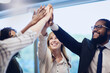 © Adene S/peopleimages.com - We did it, together. Low angle shot of a group of young businesspeople high fiving in celebration while standing in their office.