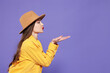 © New Africa - Beautiful young woman blowing kiss on purple background, space for text
