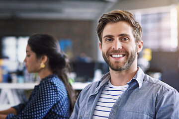 Weve got what it takes. Cropped shot of a creative businessperson working in the office.